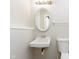 Small bathroom featuring a classic sink and toilet with neutral color scheme at 2601 Fairhaven Dr, Indianapolis, IN 46229