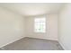 Bedroom featuring neutral carpet and a window bringing in natural light with a view outside at 2601 Fairhaven Dr, Indianapolis, IN 46229