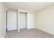 Bedroom featuring neutral carpet and a closet with sliding doors at 2601 Fairhaven Dr, Indianapolis, IN 46229