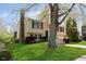 Charming two-story home with a well-maintained lawn and mature trees at 2601 Fairhaven Dr, Indianapolis, IN 46229