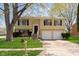 Charming two-story home with a well-maintained lawn and a two-car garage at 2601 Fairhaven Dr, Indianapolis, IN 46229