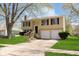 Charming two-story home with a well-maintained lawn and a two-car garage at 2601 Fairhaven Dr, Indianapolis, IN 46229