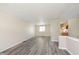 Open-concept living area with modern flooring and a seamless transition to the kitchen at 2601 Fairhaven Dr, Indianapolis, IN 46229
