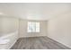 Bright living room featuring modern flooring and a large window at 2601 Fairhaven Dr, Indianapolis, IN 46229