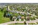 An aerial view of the neighborhood shows the property's location near a small body of water at 272 Van Buren St, Greenfield, IN 46140