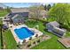 This aerial view of the property highlights a large backyard, in-ground pool, and ample space at 272 Van Buren St, Greenfield, IN 46140