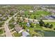 An aerial view highlights the community and this home's landscaped lot with an in-ground pool at 272 Van Buren St, Greenfield, IN 46140