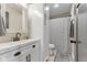 Bathroom features white vanity, modern fixtures, and striped shower curtain at 272 Van Buren St, Greenfield, IN 46140