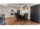 Inviting dining room featuring modern light fixture and rustic farmhouse table set in an open concept space at 272 Van Buren St, Greenfield, IN 46140