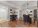 Spacious dining room featuring open space design and rustic farmhouse table set perfect for entertaining and Gathering at 272 Van Buren St, Greenfield, IN 46140
