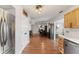Bright kitchen with stainless steel appliances opens to dining area and additional living spaces at 272 Van Buren St, Greenfield, IN 46140