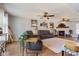 Spacious living room featuring hardwood floors, comfortable seating, and a decorative fireplace with a rustic mantel at 272 Van Buren St, Greenfield, IN 46140