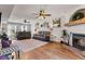 Spacious living room with hardwood floors, comfortable seating, decorative shelves, and a cozy fireplace at 272 Van Buren St, Greenfield, IN 46140