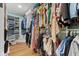 This walk-in closet features custom shelving, rods, and plenty of storage for clothing and accessories at 272 Van Buren St, Greenfield, IN 46140