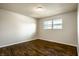 Bedroom with hardwood floors and bright window at 3127 E 52Nd St # C, Indianapolis, IN 46205