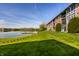 Scenic lawn view of a lakeside apartment building at 3127 E 52Nd St # C, Indianapolis, IN 46205