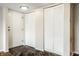 Inviting entryway with white doors, including louvered closets, and dark tile flooring, creating a stylish and organized space at 3127 E 52Nd St # C, Indianapolis, IN 46205