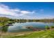 Scenic view of the lake with a wooden dock and lush green surroundings at 3127 E 52Nd St # C, Indianapolis, IN 46205
