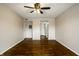 Bright living room with hardwood floors, a ceiling fan, and neutral paint at 3127 E 52Nd St # C, Indianapolis, IN 46205