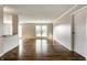 Spacious living room featuring pristine hardwood floors and abundant natural light, perfect for entertaining at 3127 E 52Nd St # C, Indianapolis, IN 46205