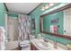 Bathroom features a shower/tub, toilet, vanity and large mirror with floral-themed shower curtain at 3283 Westpointe Dr, Franklin, IN 46131