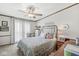 Well-lit bedroom with a plush bed, sheer curtains, and matching bedside tables at 3283 Westpointe Dr, Franklin, IN 46131