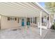 Exterior shot of a carport and front entrance with a blue door at 3283 Westpointe Dr, Franklin, IN 46131