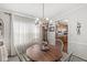 Bright dining room featuring a chandelier, wood table, and ample natural light at 3283 Westpointe Dr, Franklin, IN 46131