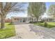 Inviting single-story home with covered parking, tidy landscaping, and a spacious driveway at 3283 Westpointe Dr, Franklin, IN 46131