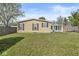Back exterior showcasing the house and lush backyard at 3283 Westpointe Dr, Franklin, IN 46131