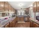 Traditional-style kitchen with wooden cabinets, stainless steel appliances, and ample counter space at 3283 Westpointe Dr, Franklin, IN 46131