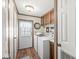 Cozy laundry room features modern washer and dryer, ample storage and access to the outside at 3283 Westpointe Dr, Franklin, IN 46131