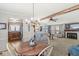 Open concept living room and kitchen area with fireplace and ceiling fan and lots of space at 3283 Westpointe Dr, Franklin, IN 46131