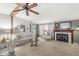 Cozy living room with fireplace, exposed beam, neutral colors, and comfortable seating at 3283 Westpointe Dr, Franklin, IN 46131