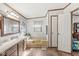 Bathroom featuring a shower-tub combination and neutral decor with wooden cabinets at 3283 Westpointe Dr, Franklin, IN 46131