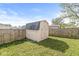 Outdoor storage shed with fenced yard and grass at 3283 Westpointe Dr, Franklin, IN 46131