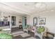 Relaxing sunroom with cozy seating, ceiling fan and abundant natural light at 3283 Westpointe Dr, Franklin, IN 46131