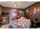 This bedroom has wood paneling, a ceiling fan, and a window at 3432 Joan Pl, Indianapolis, IN 46226