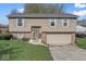 Charming two-story home featuring neutral siding, grey shutters and a two-car garage at 3432 Joan Pl, Indianapolis, IN 46226