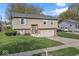 Charming two-story home featuring neutral siding, grey shutters and a two-car garage at 3432 Joan Pl, Indianapolis, IN 46226
