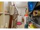 This laundry room has shelving, a washer and dryer, and a linoleum floor at 3432 Joan Pl, Indianapolis, IN 46226