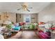 The living room has a ceiling fan and light-colored sofas at 3432 Joan Pl, Indianapolis, IN 46226