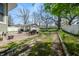 Backyard featuring a detached garage, patio area and a lush lawn at 3515 Guilford Ave, Indianapolis, IN 46205