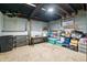 Unfinished basement space with concrete walls and tile floors, ready for customization at 3515 Guilford Ave, Indianapolis, IN 46205