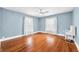 Inviting bedroom with hardwood floors and light blue walls at 3515 Guilford Ave, Indianapolis, IN 46205