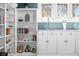 Detailed view of built-in shelving and cabinetry, showcasing decorative items and ample storage at 3515 Guilford Ave, Indianapolis, IN 46205
