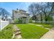 Traditional home featuring a neatly kept lawn and a welcoming front porch at 3515 Guilford Ave, Indianapolis, IN 46205