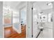 Bright hallway leads to an office and bathroom with vintage charm at 3515 Guilford Ave, Indianapolis, IN 46205