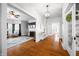 Spacious living room featuring hardwood floors, a ceiling fan, and an open layout into other living spaces at 3515 Guilford Ave, Indianapolis, IN 46205