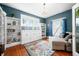 Stylish living room showcasing built-in bookshelves, natural light, and a comfortable seating area at 3515 Guilford Ave, Indianapolis, IN 46205